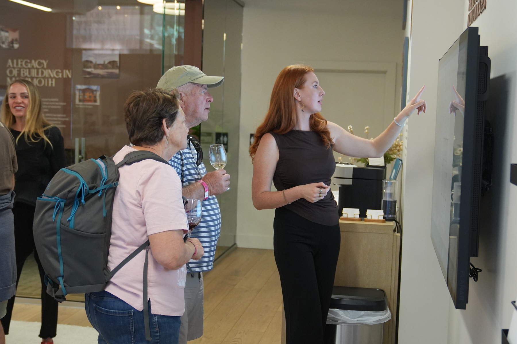 Guests exploring Rockspring on the large display in the Discovery Center.